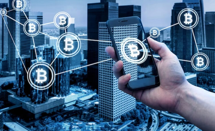Phone Held with Interconnected Bitcoin Logos Displaying City Overview